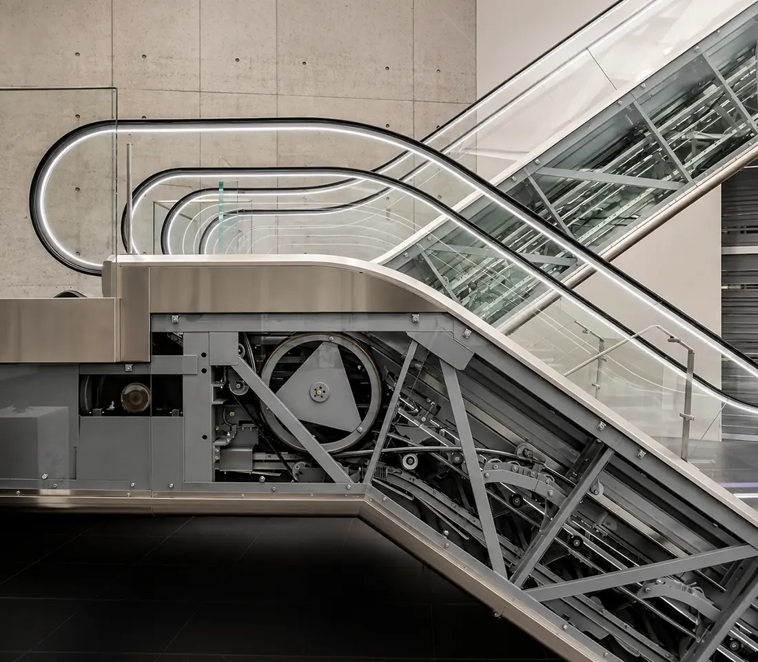 Airport escalator operating in a busy, hustling environment